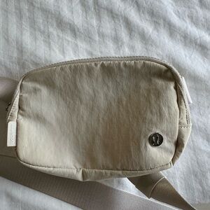 Cream, linen Lululemon belt bag.